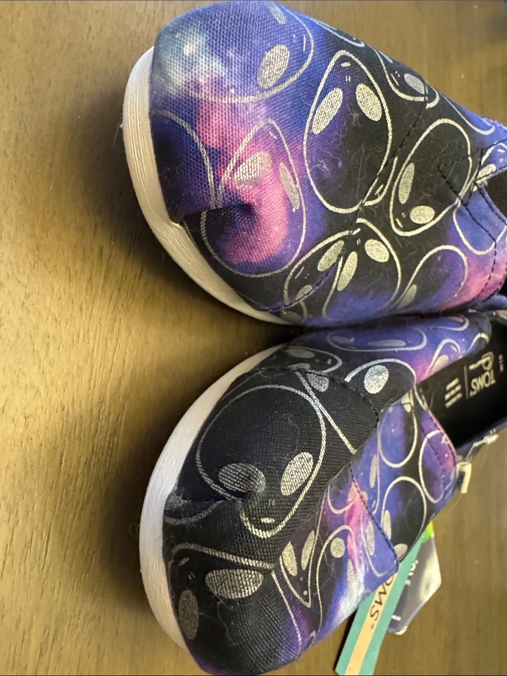 Toms Women’s Alien Galaxy Slip-On Sneakers in Purple, Black and Pink